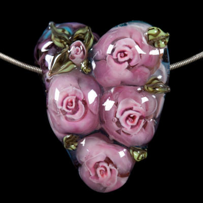 glass lampwork heart bead with pink roeses
