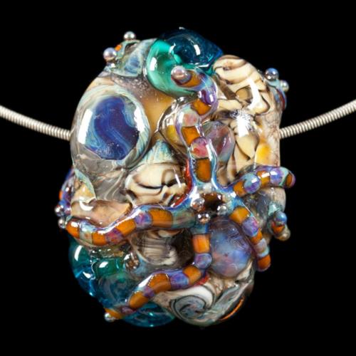 Do you long to possess a delicious slice of the ocean's paradise? Are you a connoisseur of fine art glass beads and find it thrilling to wear the finest in artisan glass lampwork beads? Then you will love this art glass work of "Ocean Starfish".