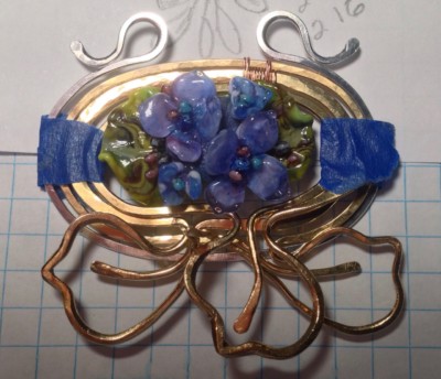 silver frame on glass flower pendant 