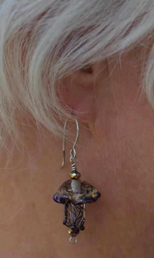 glass jellyfish earrings on model tropical flare